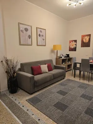 a living room with a couch and a table at Ritiro Romano in Rome