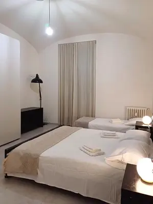 a bedroom with two beds with towels on them at Acquedotto di Nerone in Rome