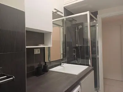 a bathroom with a white sink and a shower at Acquedotto di Nerone in Rome