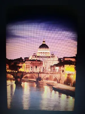 a view of a building with a bridge over a river at Rome Dolce Vita Luxury Apartment 4 km da Colosseo in Rome