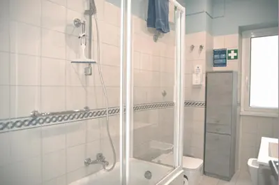 a bathroom with a shower and a toilet at Vatican Malvi Domus in Rome
