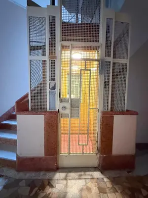 an open door with a gate in a building at Vatican Malvi Domus in Rome