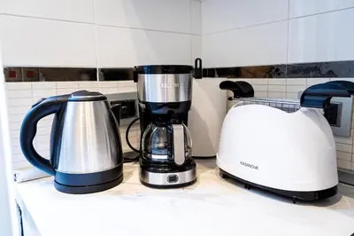two appliances sitting on a counter in a kitchen at Sanpietrino Apartment in Rome