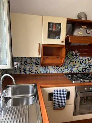 a kitchen with a sink and a stove at Alloggio turistico AVM in Rome