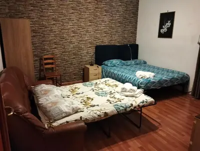 a room with a bed and a couch and a table at Appartamento Elena's House in Rome