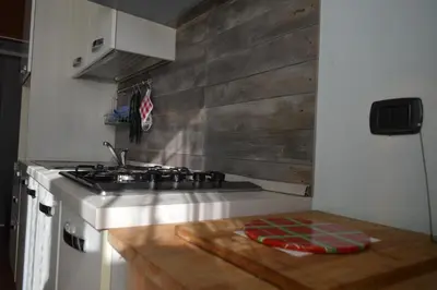 a kitchen with a stove and a counter top at Appartamento Elena's House in Rome