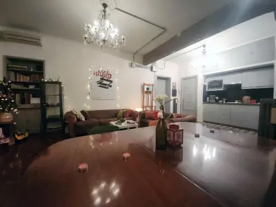a living room with a couch and a table at BedEpoque - Camera 3 in Rome
