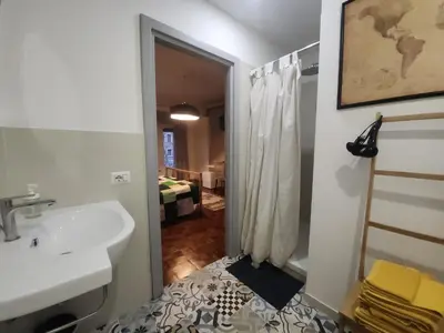 a bathroom with a sink and a mirror and a bathroom with a bedroom at BedEpoque - Camera 3 in Rome