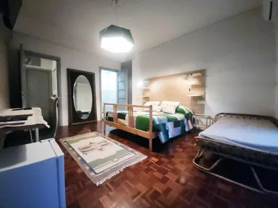 a bedroom with two beds and a table and a mirror at BedEpoque - Camera 3 in Rome