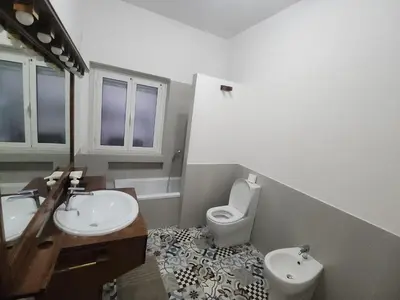 a bathroom with a toilet and a bidet and a sink at BedEpoque - Camera 1 in Rome
