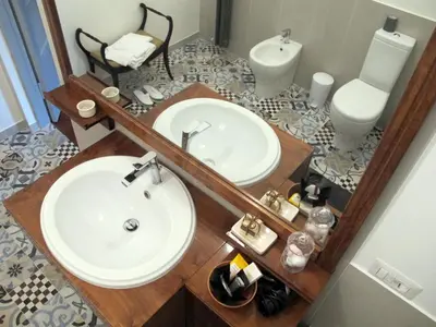 a bathroom with a sink and a toilet and a mirror at BedEpoque - Camera 1 in Rome