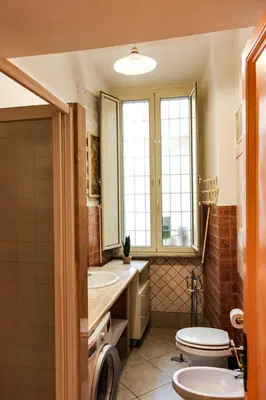 a bathroom with a toilet and a sink at Domus Vaticanae in Rome