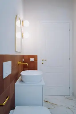 a bathroom with a white sink and a mirror at Modern apartment in Cornelia in Rome