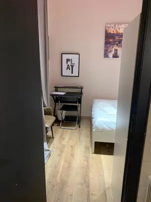 a room with a table and a bed and a desk at eternal - vatican trionfale in Rome