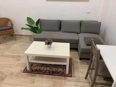 a living room with a couch and a table at unica-vatican museum in Rome