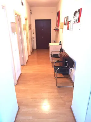 a hallway with chairs and a table in a room at Camera Privata Nomentana per medio lungo periodo in Rome