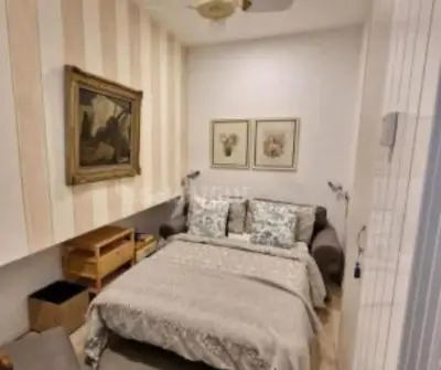a bedroom with a bed and a couch at Il Colosseo Holiday home in Rome