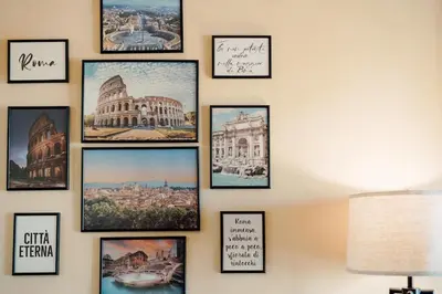 a wall with pictures of cities and buildings at Dream Vacation Suites in Rome