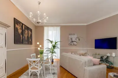 a living room with a couch and a table at Maisondesfleurs in Rome