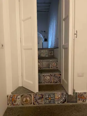 a stairway with a door leading to a room at Rome City Center Apartment in Rome