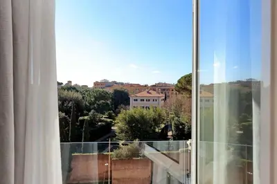 a room with a window with a view of a city at Julie's Renovated View in Rome
