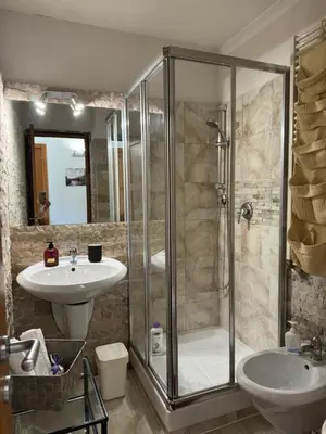 a bathroom with a shower and a sink at Mila House in Rome