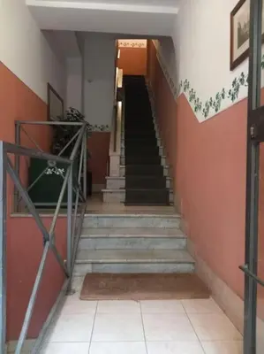 a staircase in a building with a stair case at Mila House in Rome