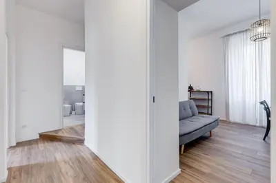 a living room with a couch and a chair at BMGA l Aurelian 3Bdr 6-Guest Gem in Rome