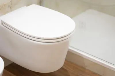 a white toilet with the seat down in a bathroom at Dolcevita Vatican Apartment in Rome