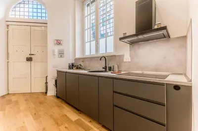a kitchen with a sink and a counter top at Via Nizza 126 Luxury in Rome