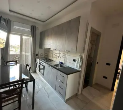 a kitchen with a sink and a stove at Biancaneve home in Rome