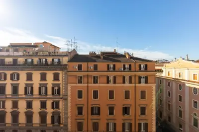 a group of tall buildings in a city at Attico Spazioso ed Elegante a Santa Maria Maggiore in Rome