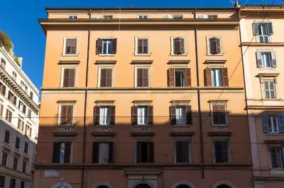 a tall building with a lot of windows at Attico Spazioso ed Elegante a Santa Maria Maggiore in Rome