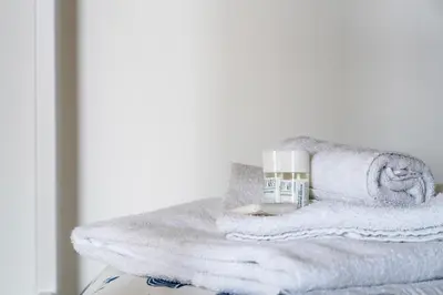 a pile of towels sitting on top of a table at Green park apartment in Rome