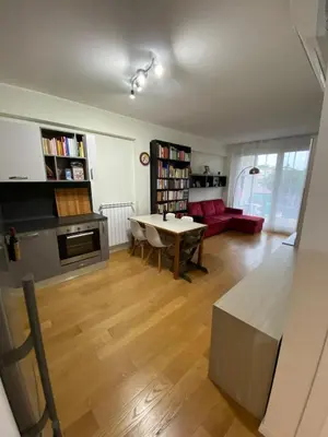 a living room with a table and a couch at Green park apartment in Rome