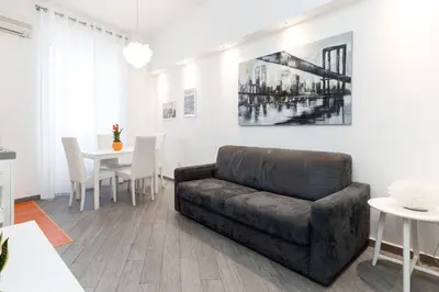 a living room with a couch and a table at asyouRhOME - Nico - San Pietro Vaticano in Rome