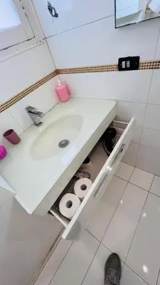 a bathroom with a white sink and some toilets at apt via cernaia rome center in Rome