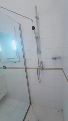 a shower with a glass door in a bathroom at apt via cernaia rome center in Rome