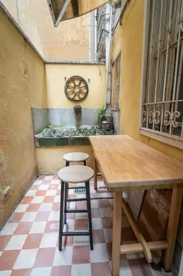a room with two stools and a map on the wall at Home d'Elite Sistina - Trevi Fountain in Rome