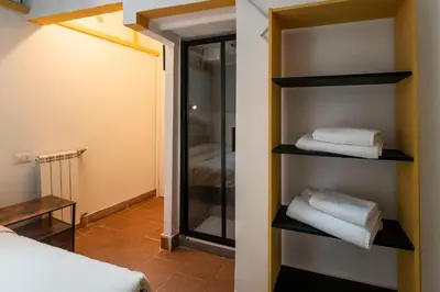 an attic hallway with a skylight and a door at Home d'Elite Sistina - Trevi Fountain in Rome