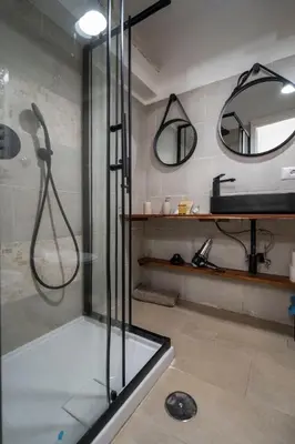 a bathroom with a white toilet and a sink at Home d'Elite Sistina - Trevi Fountain in Rome