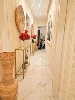 a hallway with vases and flowers on the walls at VATICANO 13 Guest House in Rome