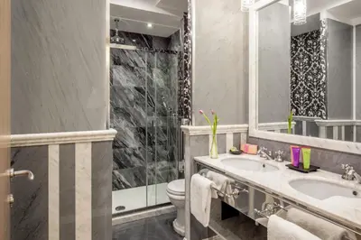 a bathroom with a sink and a toilet at The Inn at the Spanish Steps Exclusive Collection - The Nest Penthouse in Rome