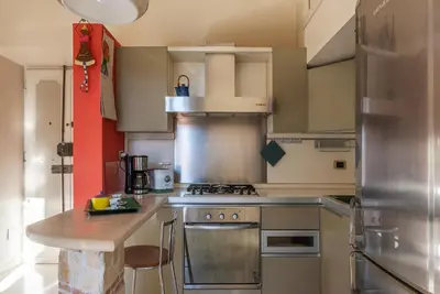 a kitchen with a stove and a counter top at Casa Emma - Charme Holidays in Rome