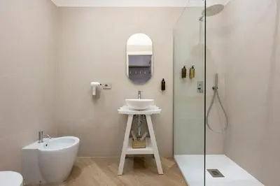 a bathroom with a sink and a shower at Eudora Guesthouse Roma in Rome