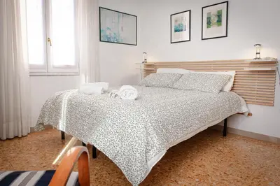 a bedroom with a bed with two towels on it at Laura's Rooms in Rome