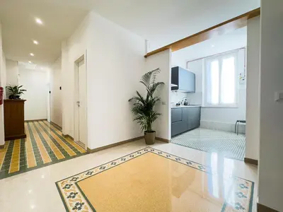 a room with a hallway with a potted plant in it at Laura's Rooms in Rome