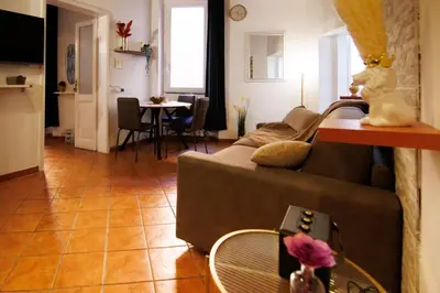a living room with a couch and a table at Crezy House Trilussa in Rome