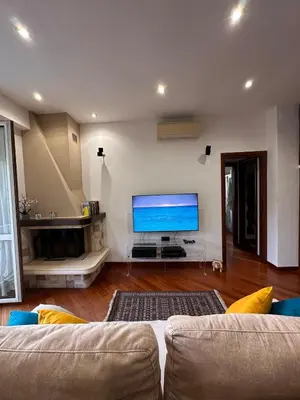 a living room with a couch and a flat screen tv at Casa Turchina in Rome
