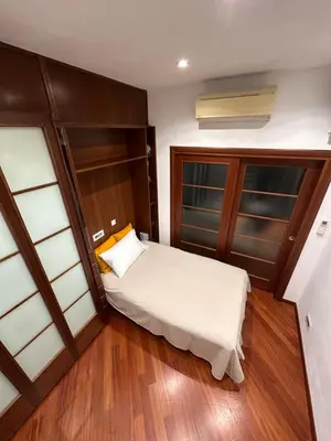 a small bedroom with a bed and a window at Casa Turchina in Rome